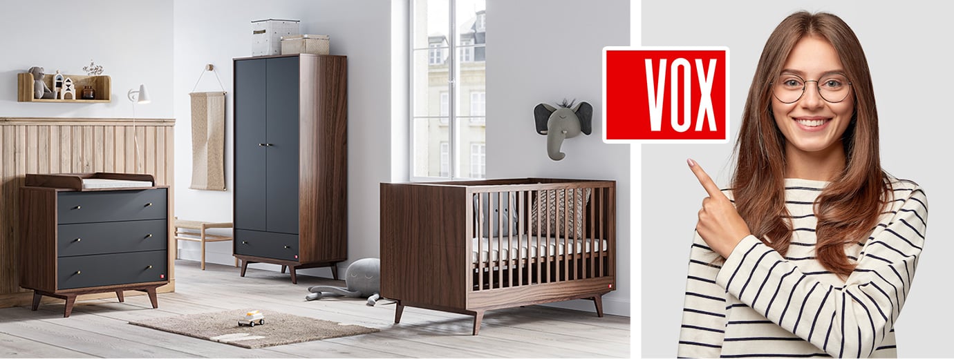 Chambre bébé équipée de meubles noir et noyer de la collection MID du fabricant polonais VOX