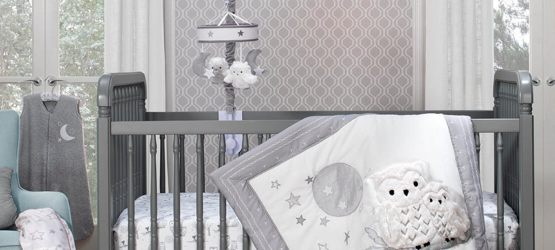Chambre bébé avec une déco sur le thème de la Chouette